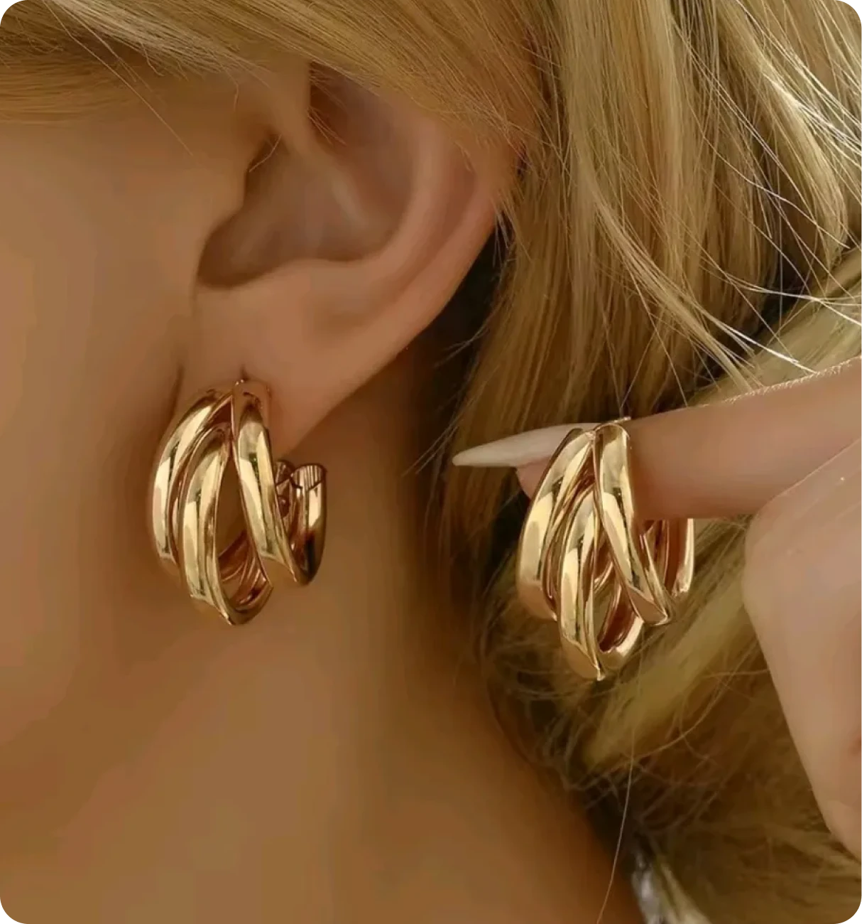 Stylish gold earrings on display